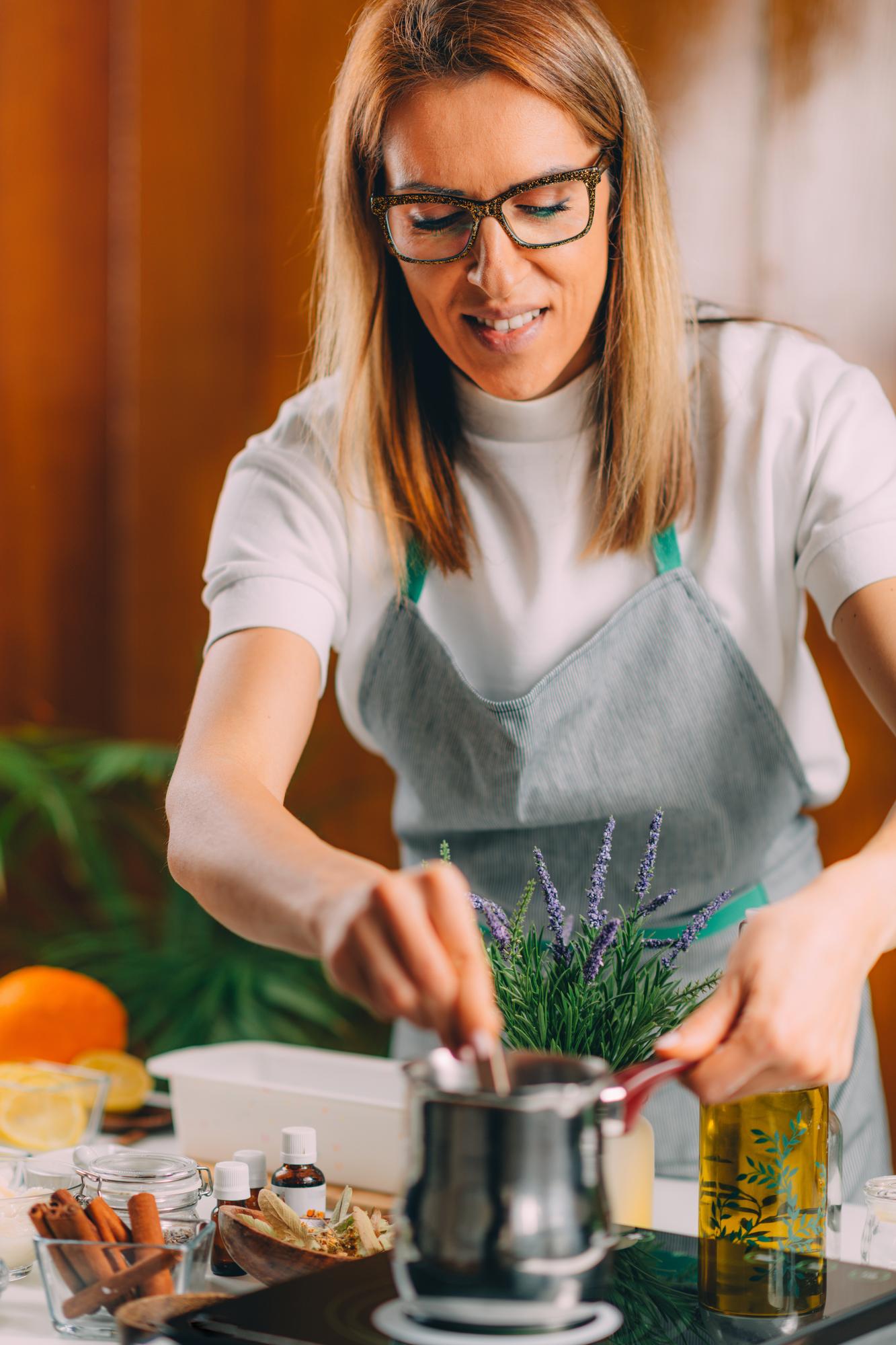 Founder portrait in kitchen with herbs and tools